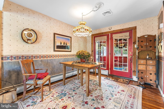 dining space featuring wood-type flooring