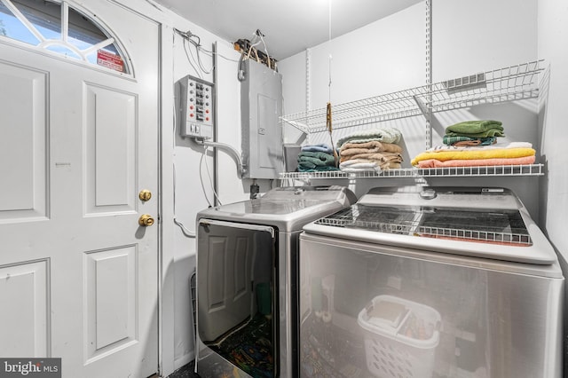 washroom with washing machine and clothes dryer