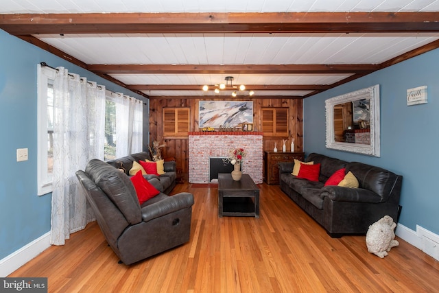 862 Bay Ave, Toms River, NJ 08753 - living room featuring a brick fireplace, beamed ceiling, and light wood-type flooring
