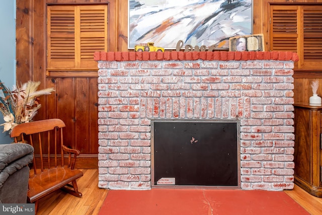 862 Bay Ave, Toms River, NJ 08753 - interior details with hardwood / wood-style flooring, a fireplace, and wood walls