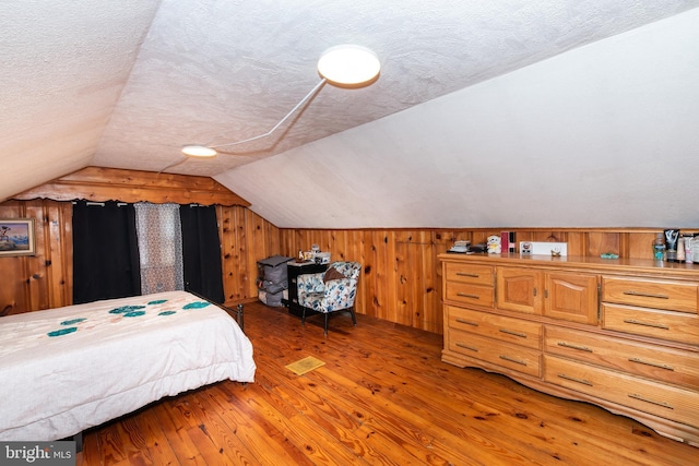 862 Bay Ave, Toms River, NJ 08753 - bedroom with hardwood / wood-style flooring, vaulted ceiling, and a textured ceiling