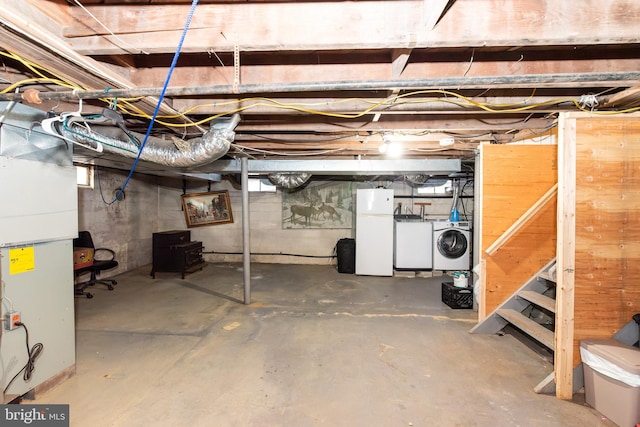 862 Bay Ave, Toms River, NJ 08753 - basement featuring heating unit, washer and clothes dryer, and white refrigerator