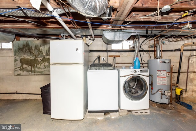 862 Bay Ave, Toms River, NJ 08753 - clothes washing area with gas water heater and washer and dryer
