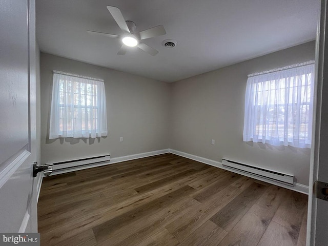 empty room with ceiling fan, wood-type flooring, and a baseboard radiator