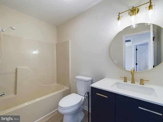 full bathroom with toilet, bathing tub / shower combination, wood-type flooring, and vanity