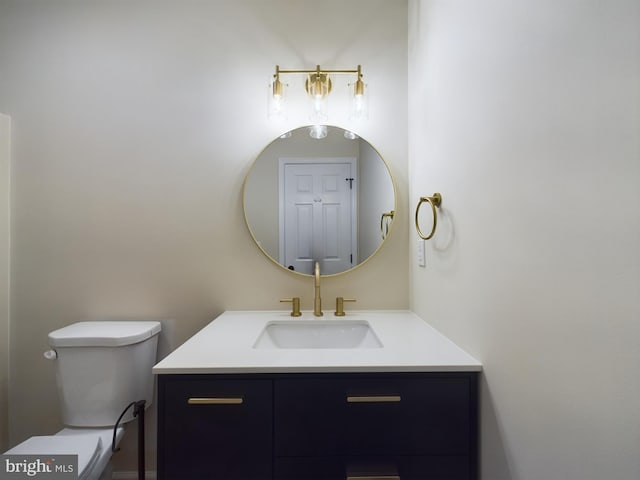 bathroom with toilet and vanity