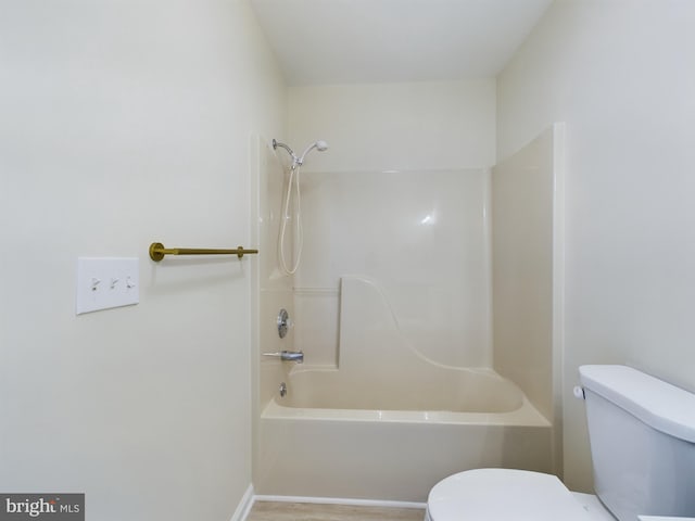 bathroom featuring toilet and washtub / shower combination