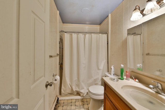 full bathroom with toilet, vanity, and shower / tub combo with curtain