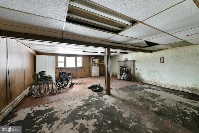 basement featuring a paneled ceiling