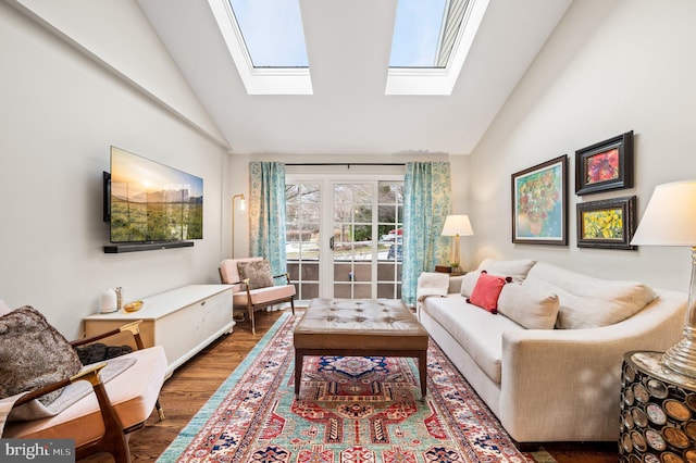 living room with dark wood-type flooring and vaulted ceiling with skylight