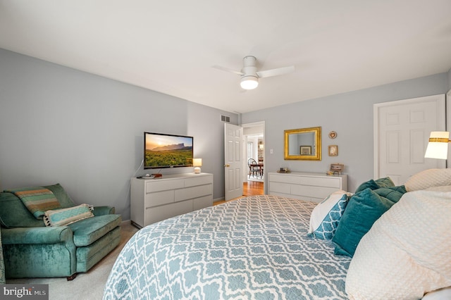 bedroom with light colored carpet and ceiling fan