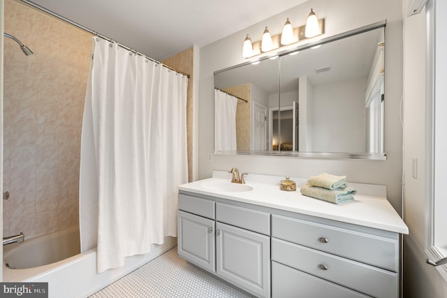 bathroom with vanity and shower / bath combo