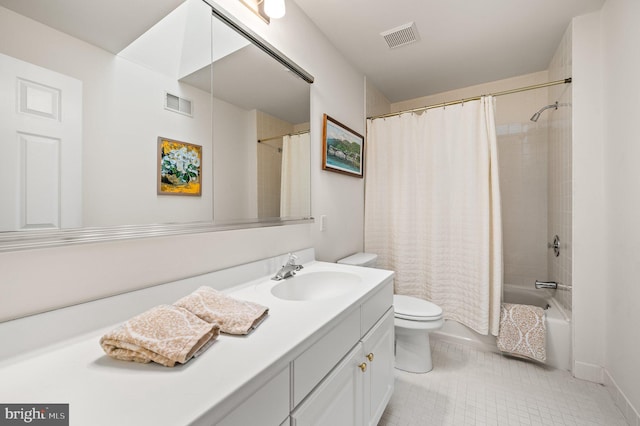 full bathroom with tile patterned flooring, vanity, shower / bath combo with shower curtain, and toilet