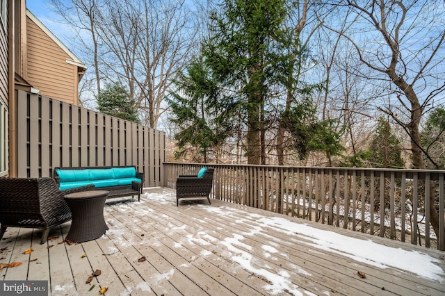 wooden terrace featuring an outdoor living space