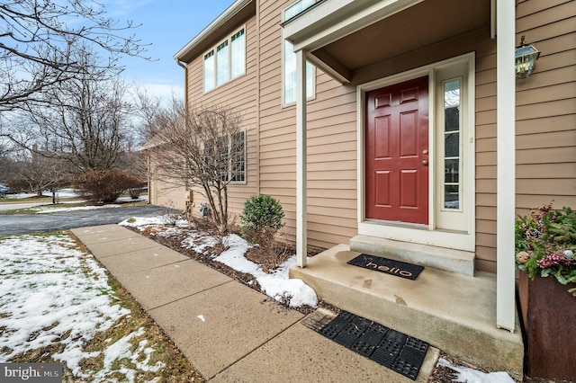 view of snow covered property entrance