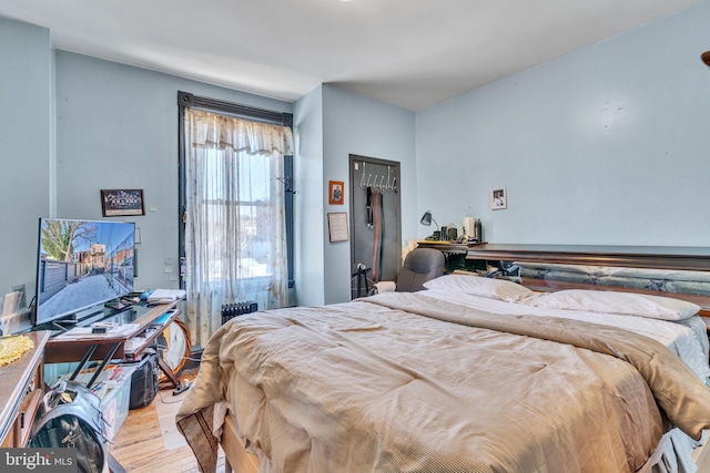 bedroom with light hardwood / wood-style floors