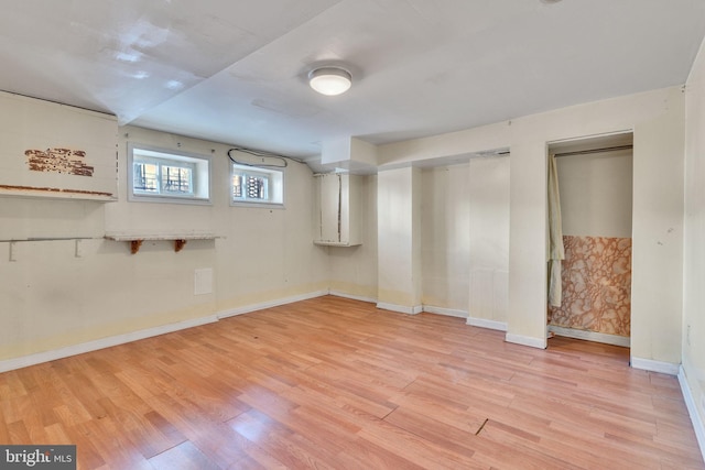 basement featuring light hardwood / wood-style flooring