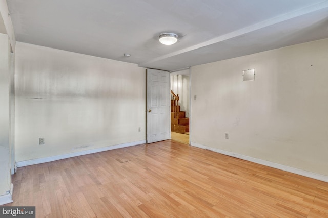 spare room featuring light wood-type flooring