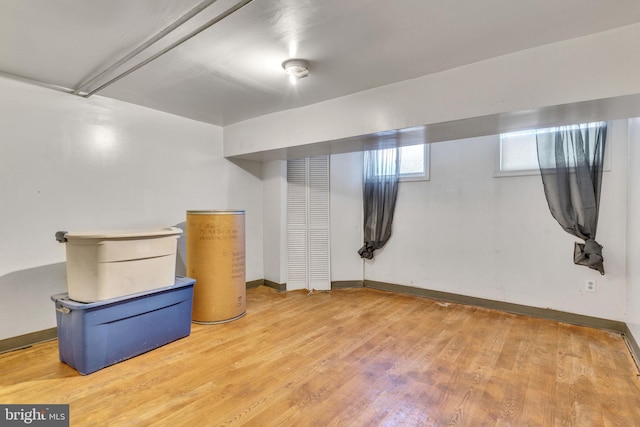 basement with hardwood / wood-style flooring