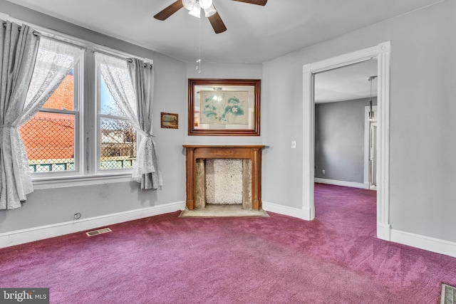 unfurnished living room with ceiling fan, light colored carpet, and a healthy amount of sunlight