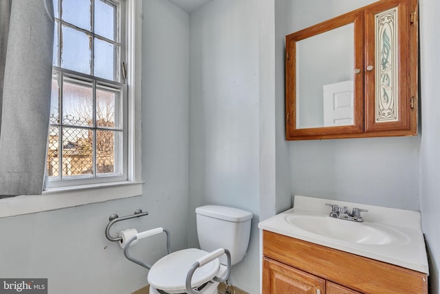 bathroom with toilet and vanity