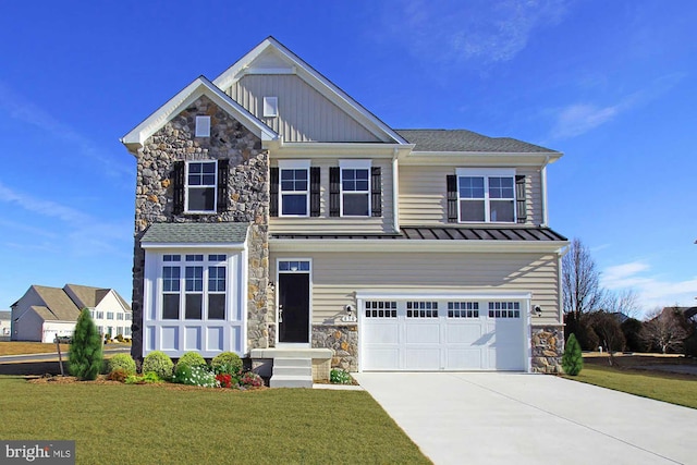 craftsman house with a front lawn and a garage