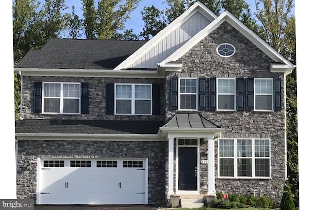 craftsman inspired home with a garage