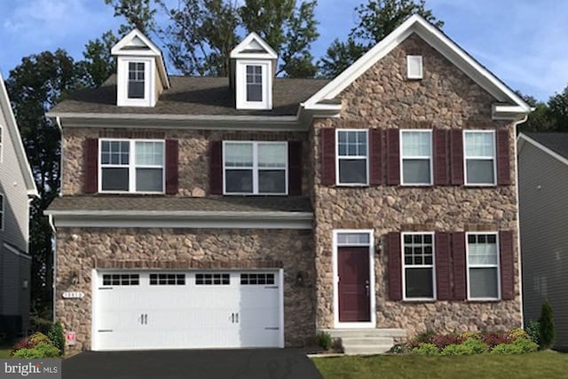 view of front of property featuring a garage