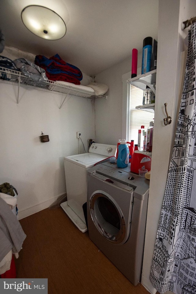 washroom featuring separate washer and dryer and wood-type flooring