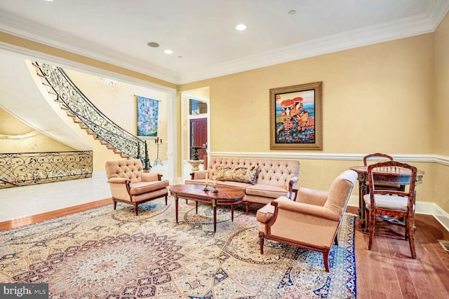 living room featuring crown molding and wood-type flooring