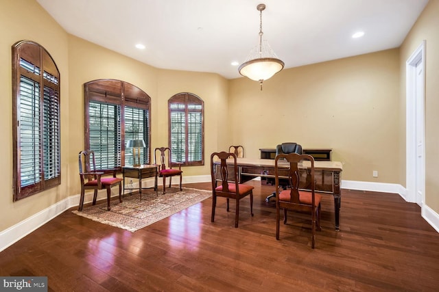 dining room with dark hardwood / wood-style flooring