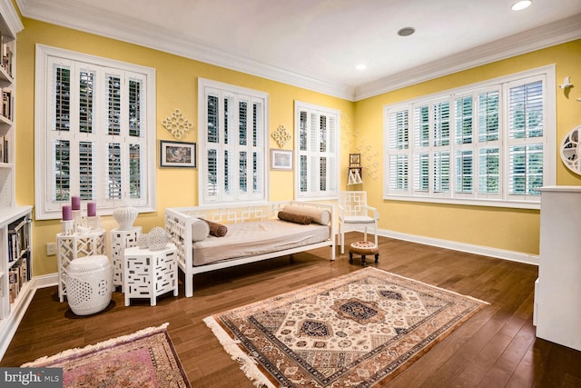 sitting room with dark hardwood / wood-style flooring and ornamental molding