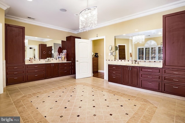 bathroom featuring ornamental molding, tile patterned floors, vanity, and a chandelier