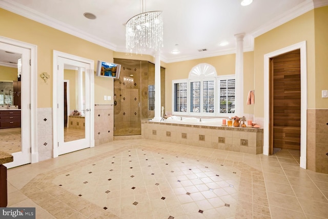 bathroom featuring independent shower and bath, crown molding, tile patterned flooring, and tile walls