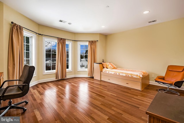 bedroom with wood-type flooring