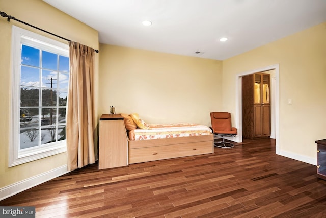 bedroom featuring dark hardwood / wood-style flooring