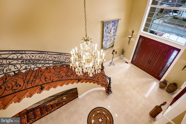 foyer entrance with an inviting chandelier