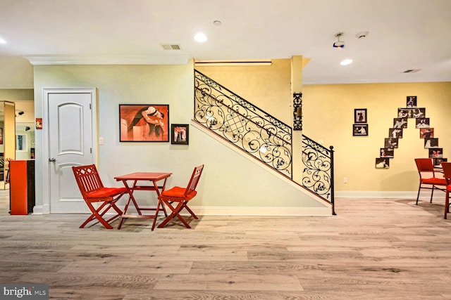 sitting room with hardwood / wood-style floors