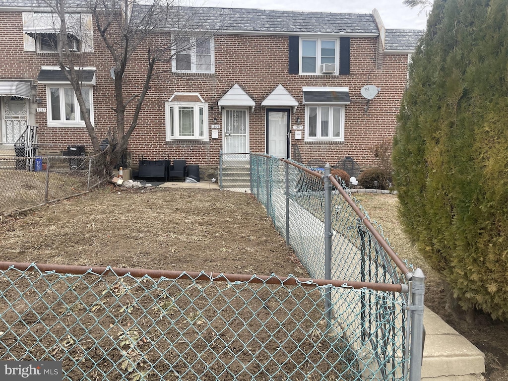 view of front of house featuring cooling unit