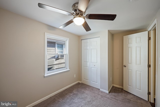 unfurnished bedroom with ceiling fan, light colored carpet, and a closet