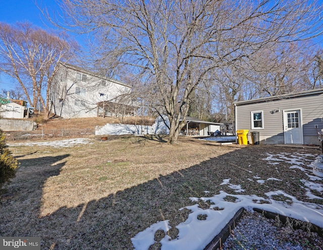 view of yard layered in snow