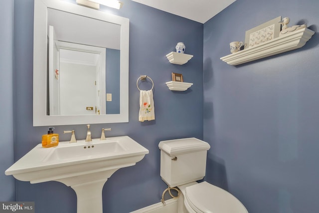 bathroom with sink and toilet