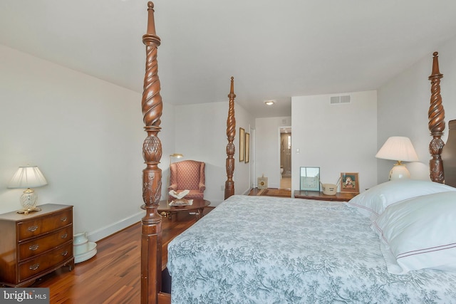 bedroom with wood-type flooring