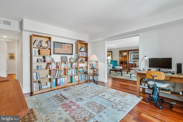 office area with hardwood / wood-style floors