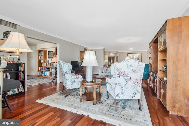 living room featuring dark hardwood / wood-style floors and ornamental molding