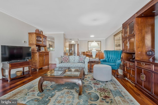 living room with dark wood-type flooring and ornamental molding