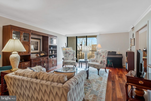 living room with dark wood-type flooring and ornamental molding