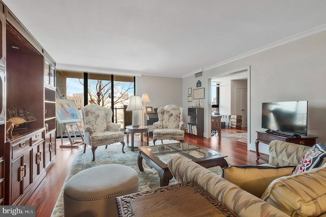 living room with floor to ceiling windows, hardwood / wood-style floors, and ornamental molding