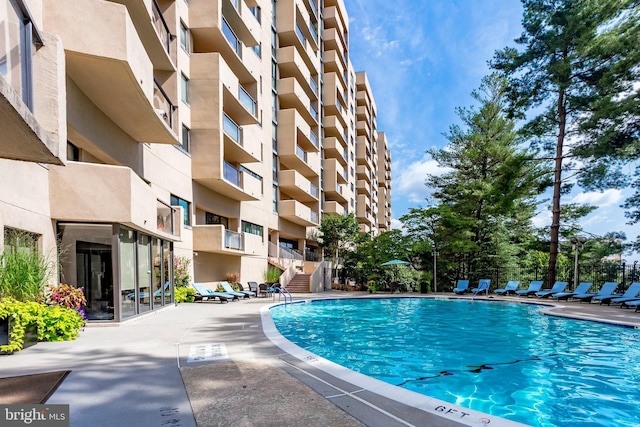 view of pool featuring a patio area