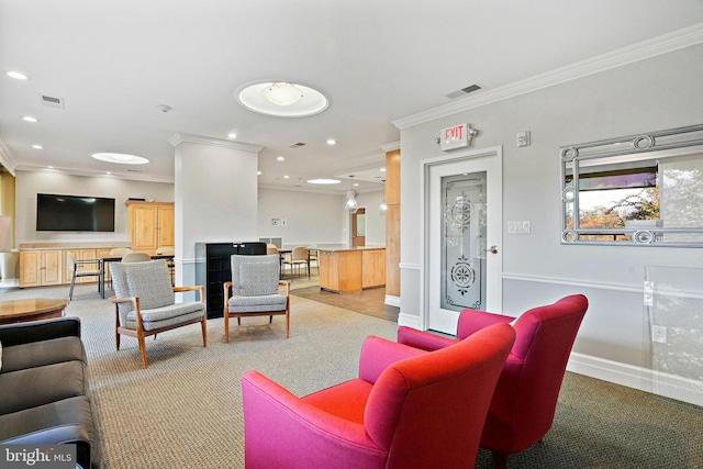 carpeted living room with ornamental molding